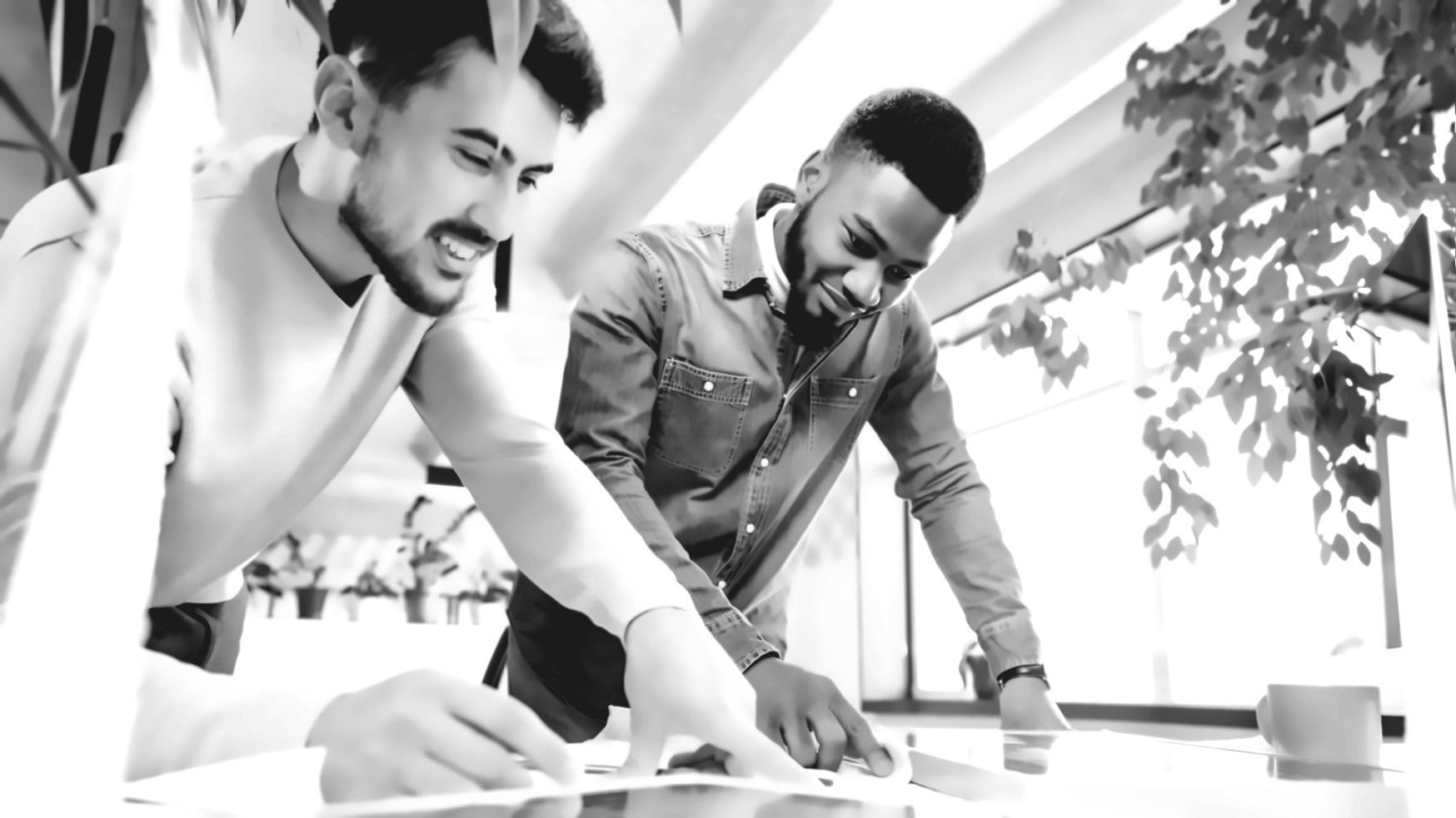Person reviewing financial documents and making budget adjustments
