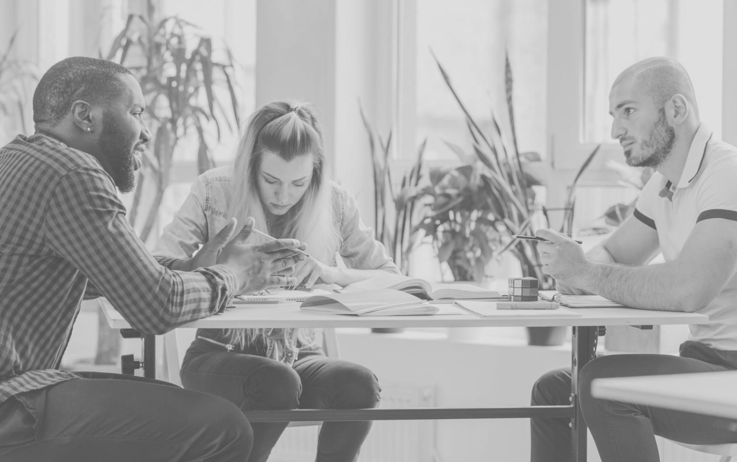 Collaborative workspace showing financial planning materials and team discussions